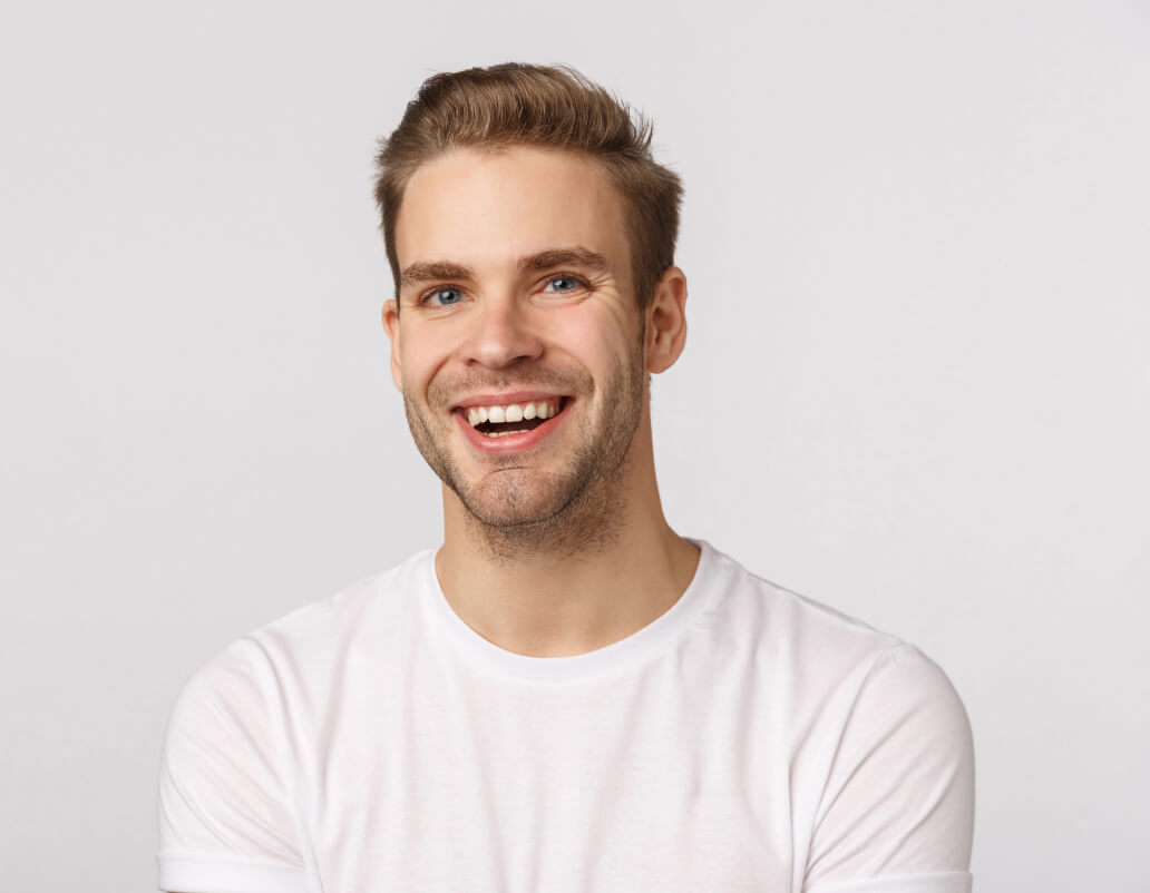 handsome-blond-guy-with-blue-eyes-white-t-shirt-smiling 1